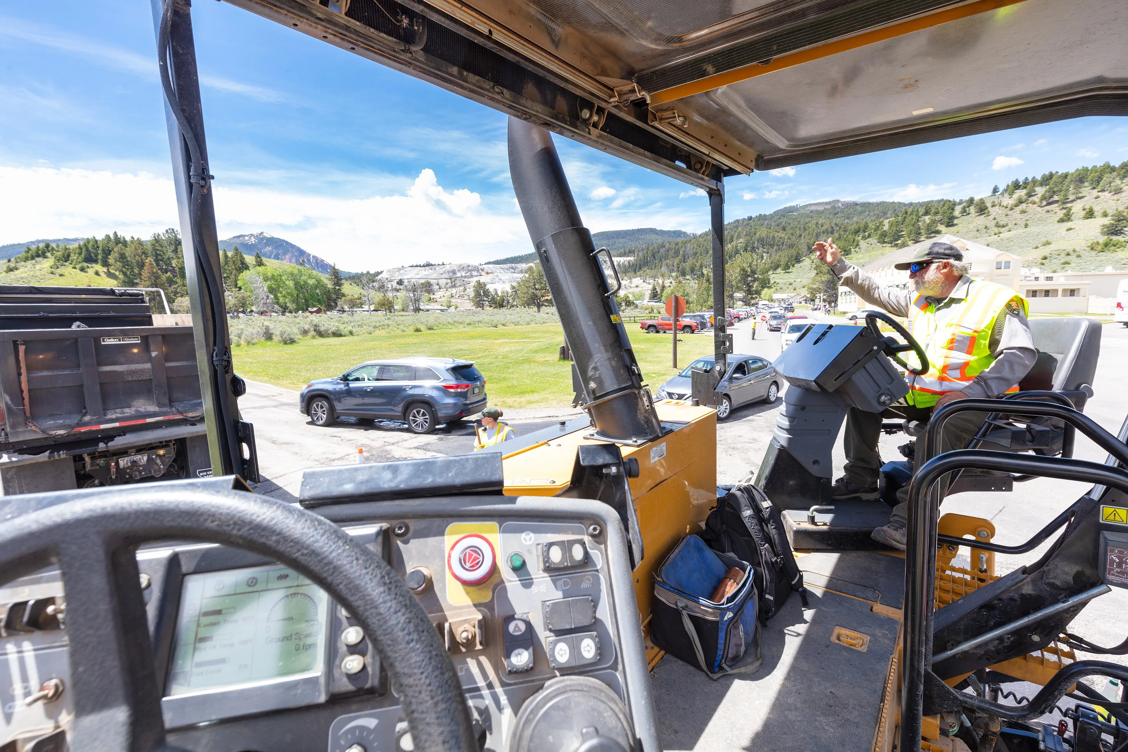 Paving machine operator on a road repair site